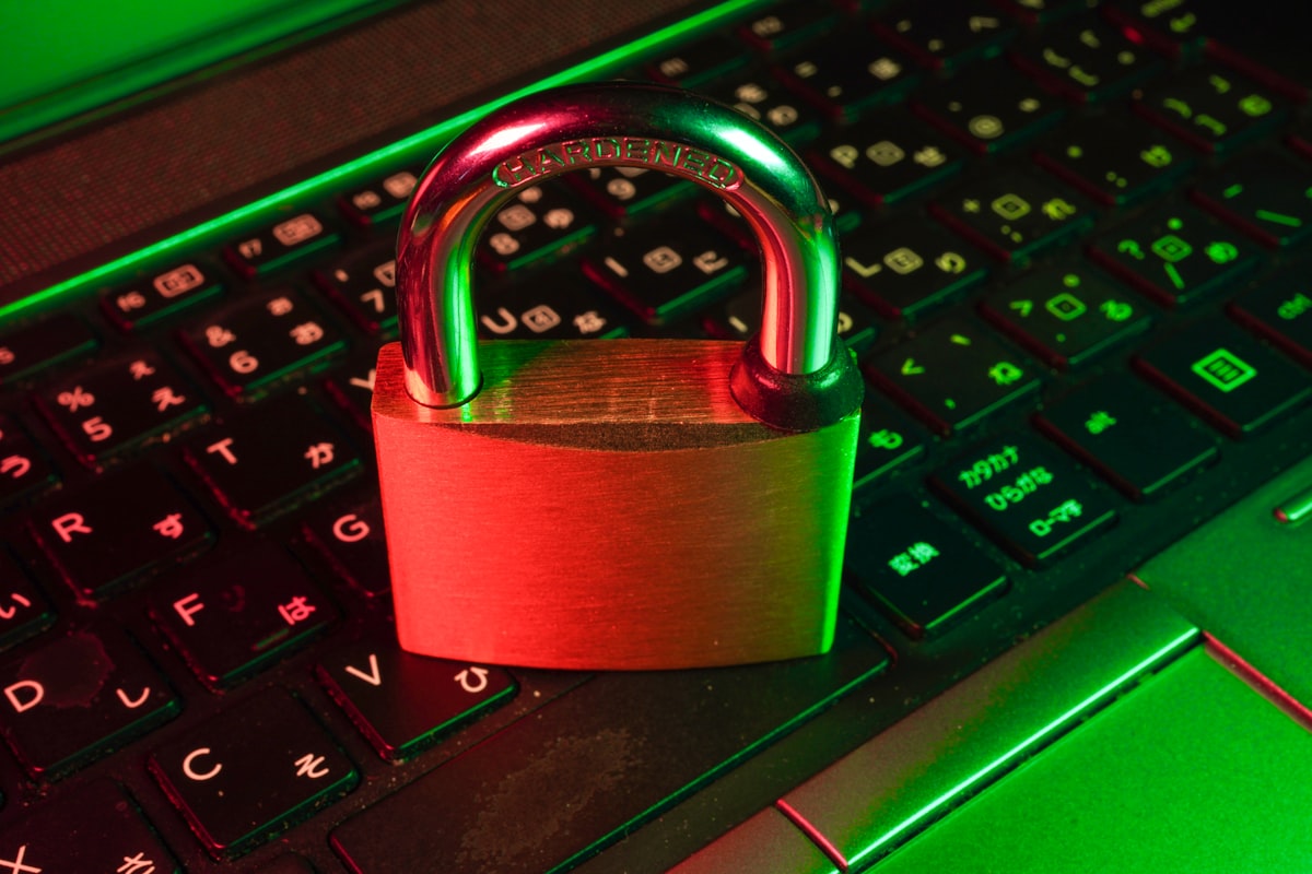 Golden padlock resting on a computer keyboard symbolizing AI agent identity and access management security