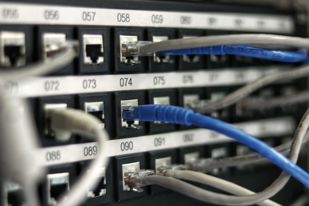 Network patch panel with disconnected ethernet ports representing MCP protocol backlash and developers moving away from the standard