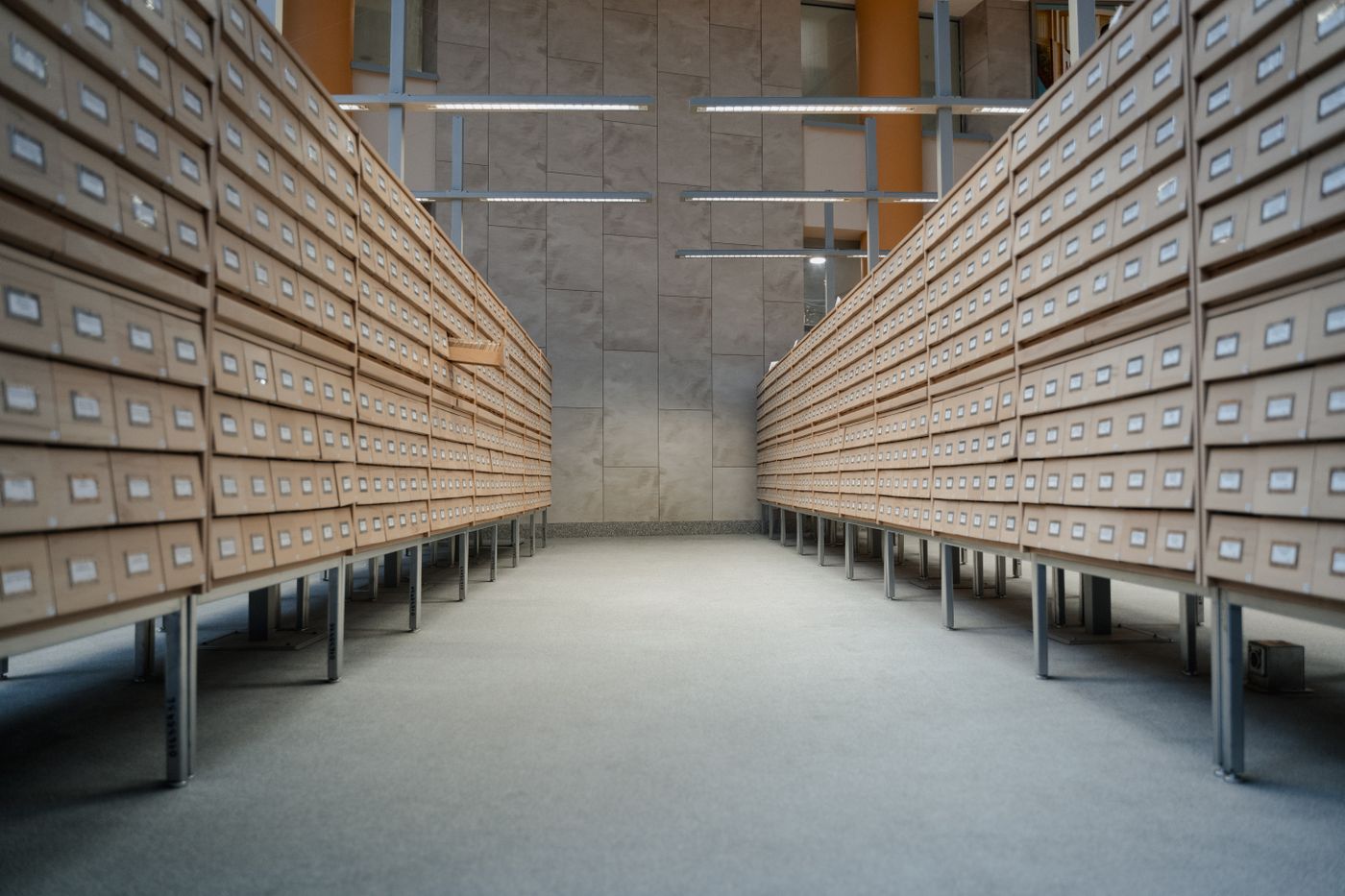 Long rows of library card catalog drawers, a visual metaphor for comparing Mem0, Zep and Redis as agent memory stores